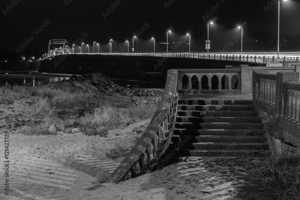 Fototapeta premium Bridge with stairs at night in black and white