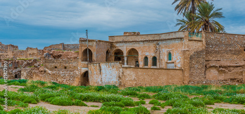 Bild auf Leinwand Abandoned building in Iraqi over an old castle