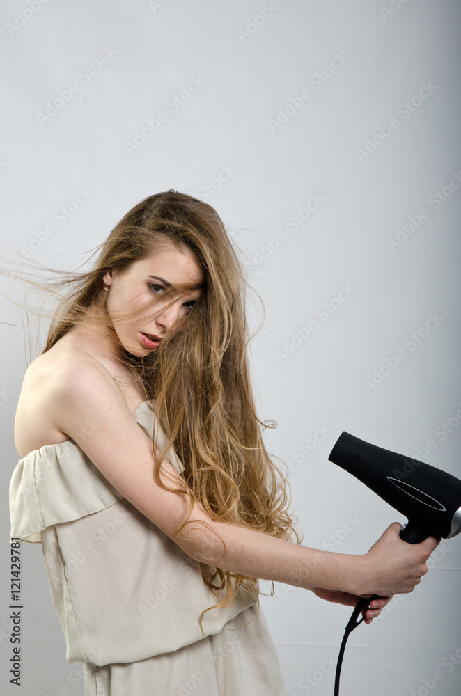 girl in pajamas and a Hairdryer girl in pajamas and a Hairdryer