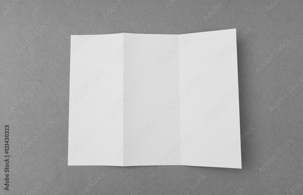 Trifold white template paper on gray  background .