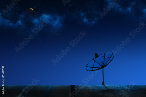Small Satellite Dish on the Building Roof with Stardust and Moon in the Sky at Night