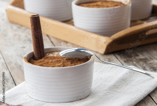Creamy rice pudding sprinkled with cinnamon