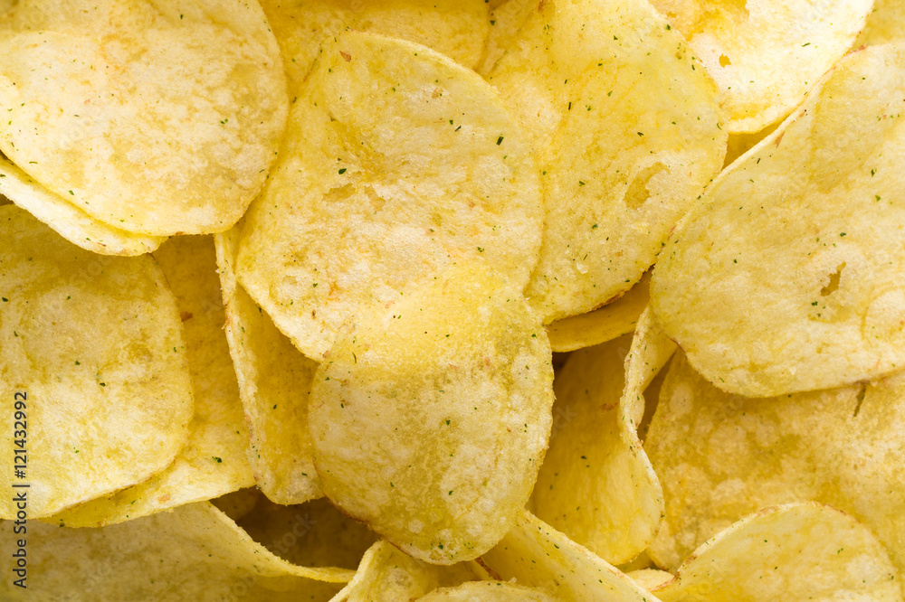Close up potato chips on top view background. Close up potato chips on top view background.