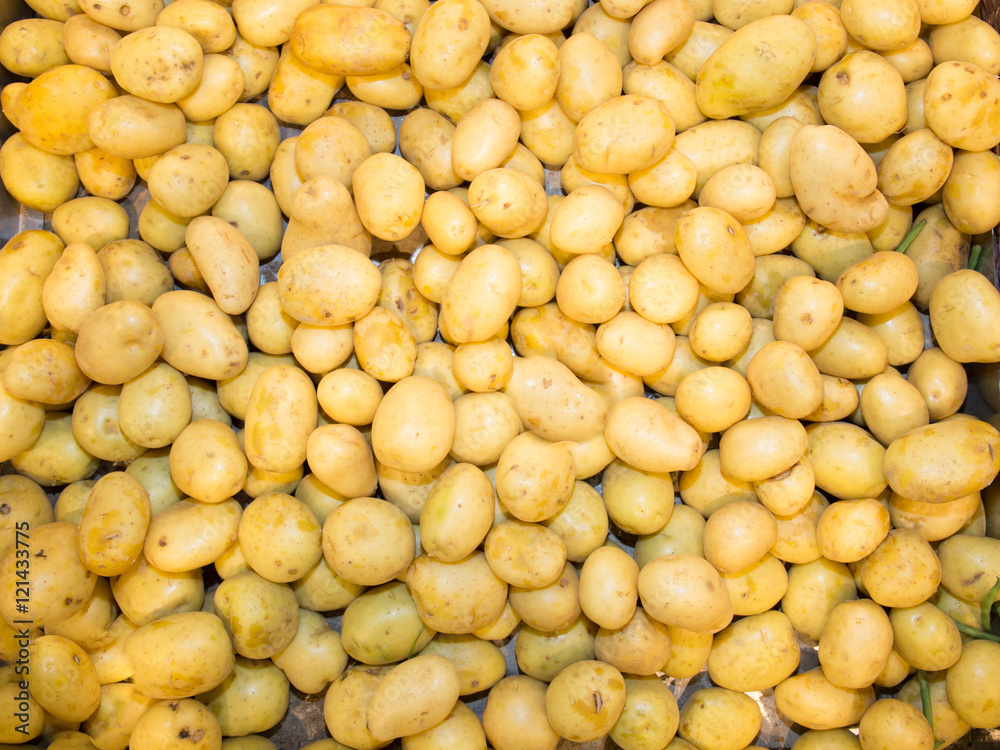 Close-up of a fresh raw potatoes background Close-up of a fresh raw potatoes background
