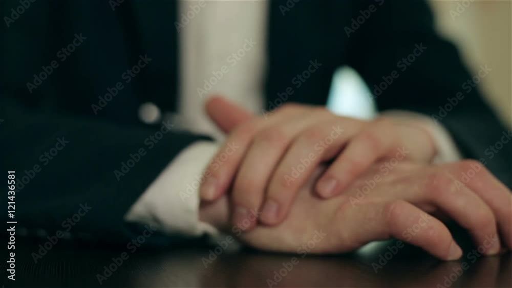 Man's hands are on the table. Man's hands are on the table.