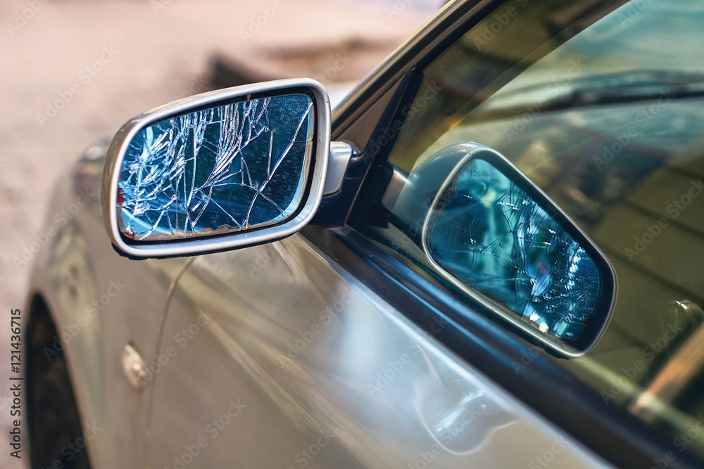 Car with broken side door mirror
