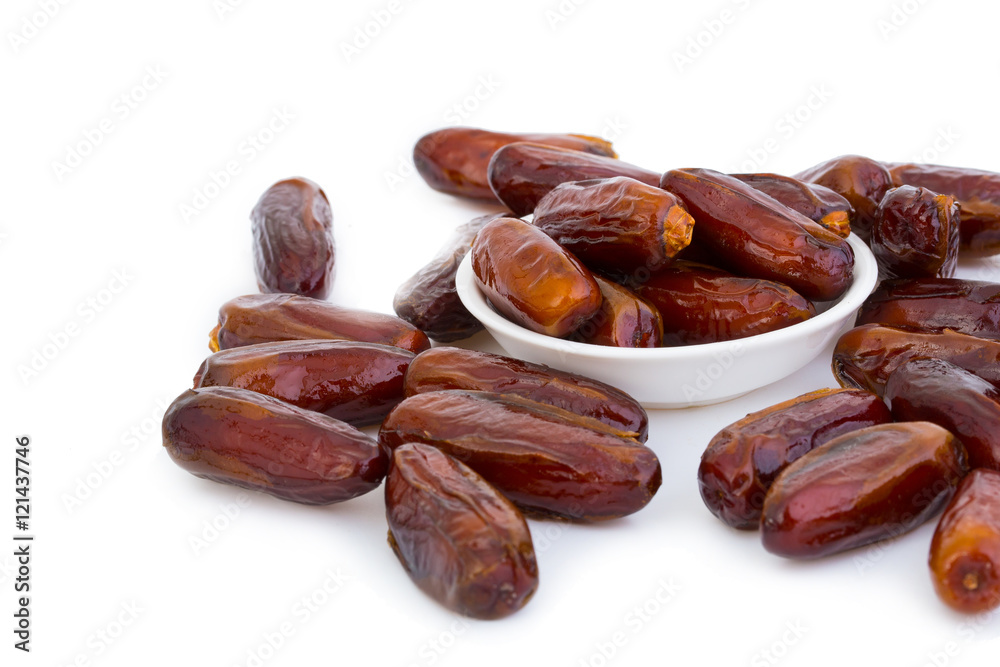 Sweet and healthy dates isolated on white background.