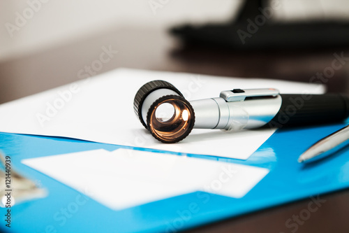 Included Dermatoscope on the table