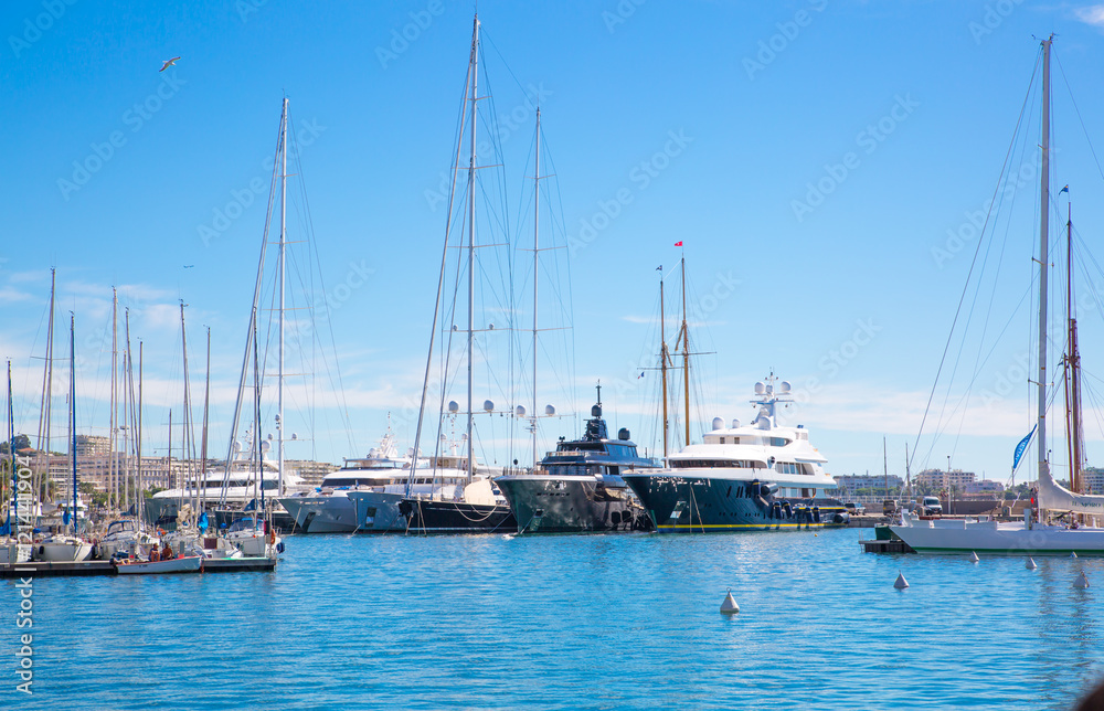 CANNES, FRANCE - 19 SEPTEMBER, 2016: Vieux Port (old port) in the city of Cannes, with lots of sailing boats and power yachts anchored during the Sailing regatta