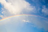 rainbow in the blue sky.A picture for concept of rainy season.