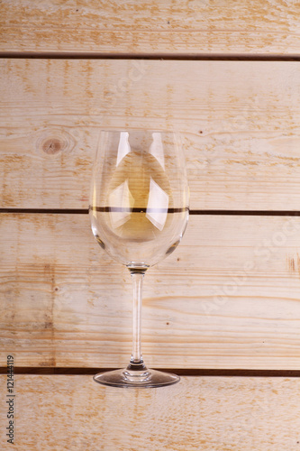 Glass of white wine on wood