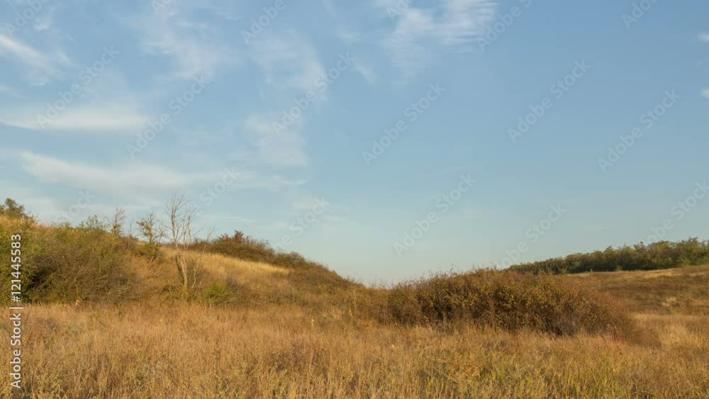 Russia, timelapse. The formation and movement of clouds over autumn endless green fields of grass in the vast steppes of the Don. Russia, timelapse. The formation and movement of clouds over autumn endless green fields of grass in the vast steppes of the Don.