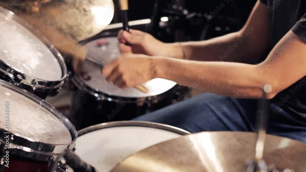 male musician playing drums and cymbals at concert male musician playing drums and cymbals at concert