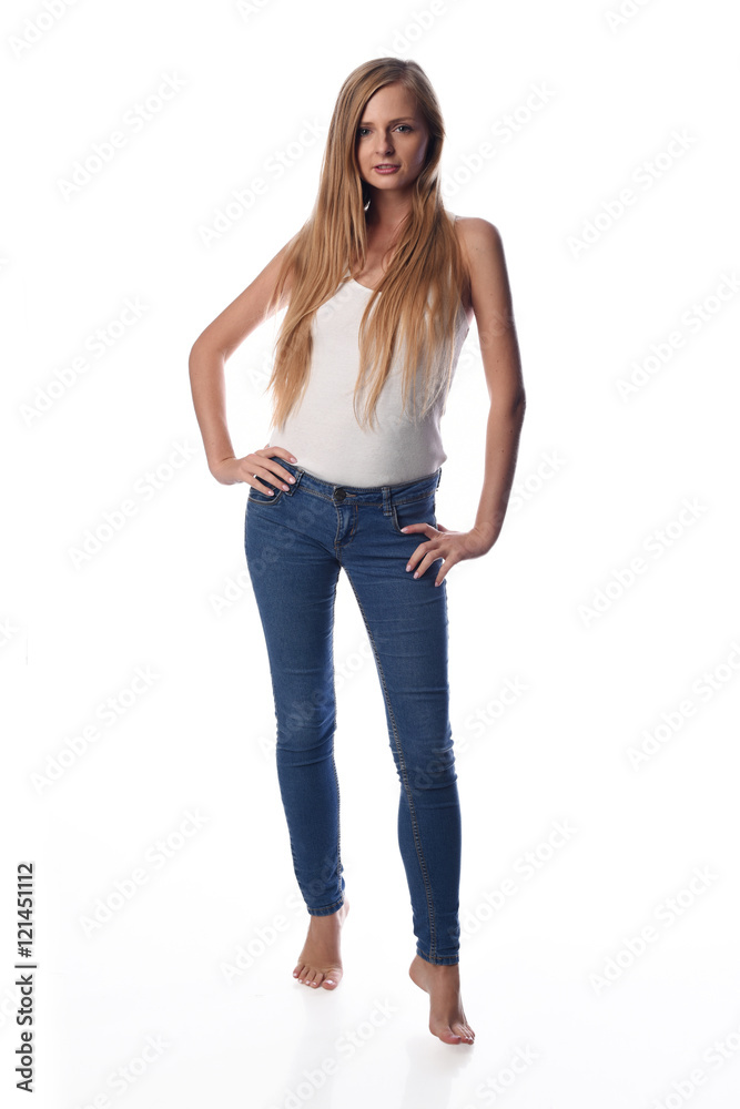 Young pretty long haired blonde woman posing in casual clothes on white background in a studio. Spring summer photo, catalog collection. Young pretty long haired blonde woman posing in casual clothes on white background in a studio. Spring summer photo, catalog collection.