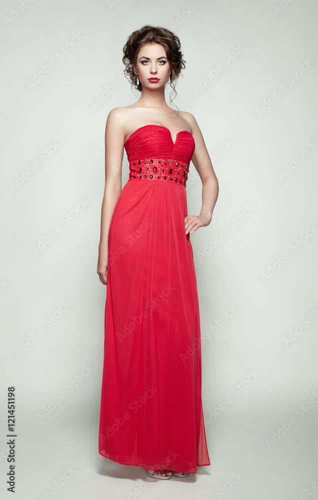 Fashion portrait of beautiful woman in elegant dress. Girl with elegant hairstyle and jewelry Fashion portrait of beautiful woman in elegant dress. Girl with elegant hairstyle and jewelry
