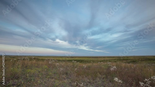 Russia, timelapse. The formation and movement of clouds over autumn endless green fields of grass in the vast steppes of the Don.