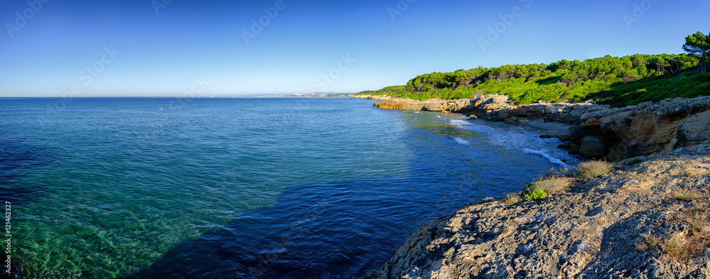 Panoramic view on multiple rocky harbors near Tarragona, Spain