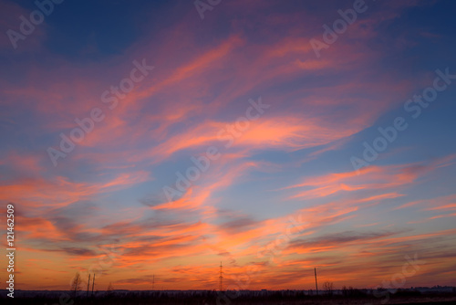 sunset sky clouds orange electric power lines tower