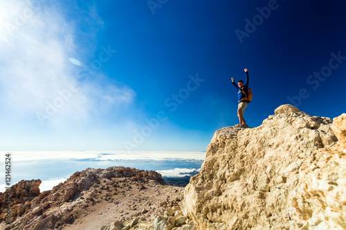 Hiking man or trail runner looking at view in mountains  inspirational landscape view.