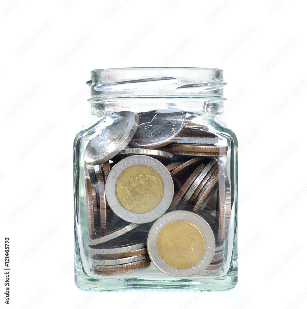 Investment growth concept,Golden coins in clear jar over white background,saving money concept. Investment growth concept,Golden coins in clear jar over white background,saving money concept.