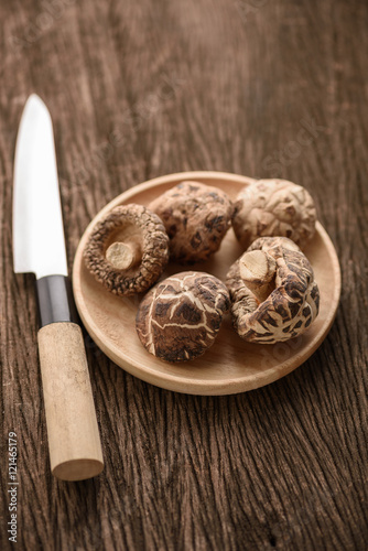 dried shiitake mushroom in wood dish for food background