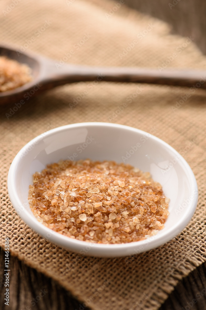 Raw Organic Cane Sugar in white ceramic bowl Raw Organic Cane Sugar in white ceramic bowl