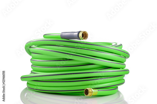 Long garden hose rolled-up isolated on white background