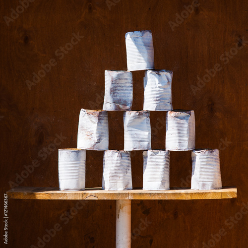 Pyramid of used soup cans in an attraction booth