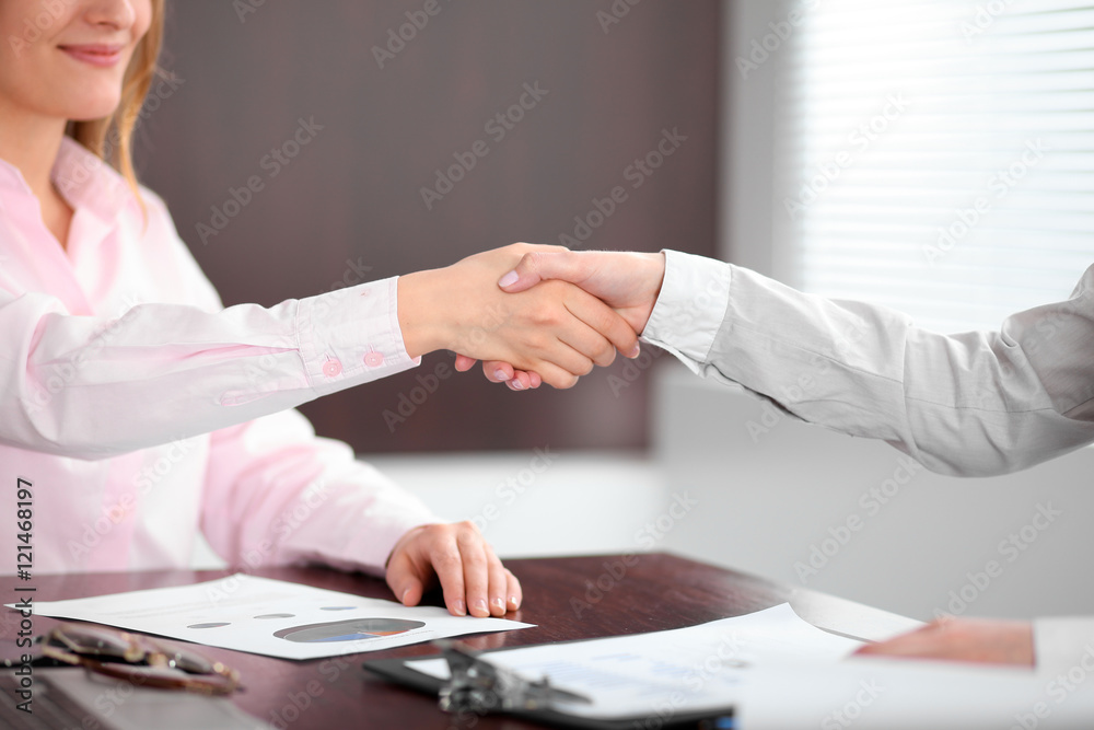 Business people shaking hands, finishing up a meeting Business people shaking hands, finishing up a meeting