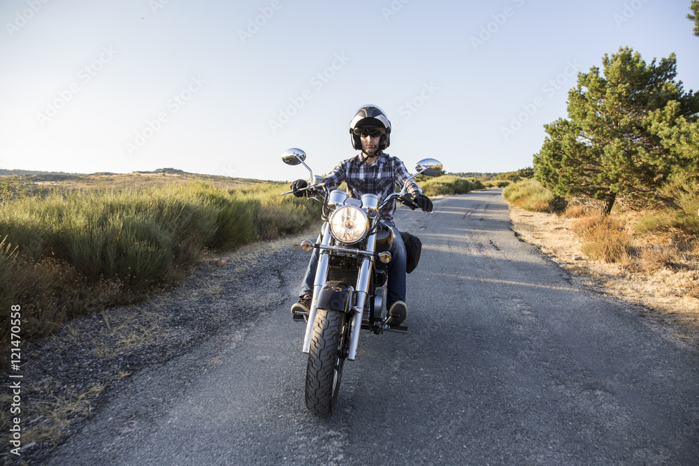 Man riding motorbike on open road Man riding motorbike on open road
