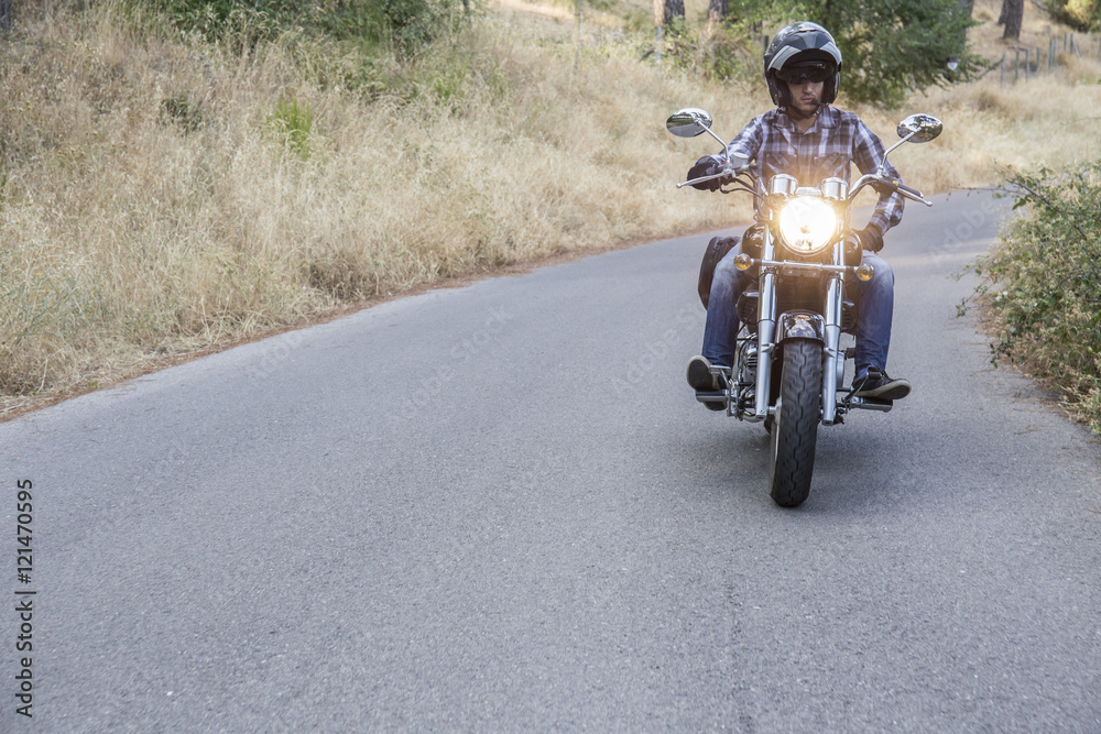 Man riding motorbike on open road Man riding motorbike on open road