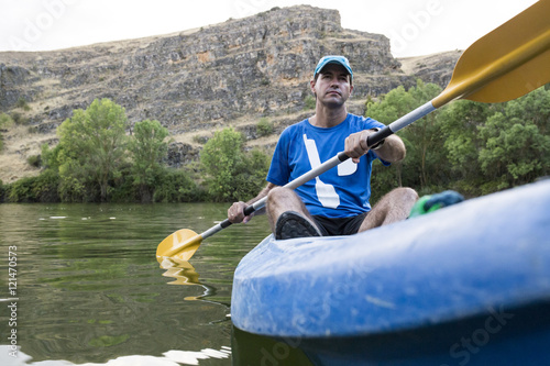 Spain, Segovia, Man in a canoe in Las Hoces del Rio Duraton photo