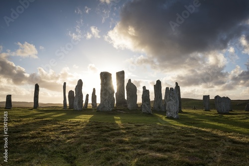 UK, Scotland, Isle of Lewis, Callanish, view to formation of standing stones at backlight