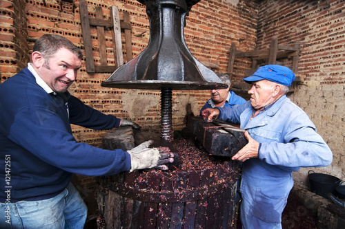 Ταπετσαρία farmers making wine  in traditional winepress  in  Villarejo de Orbigo, Leon , S