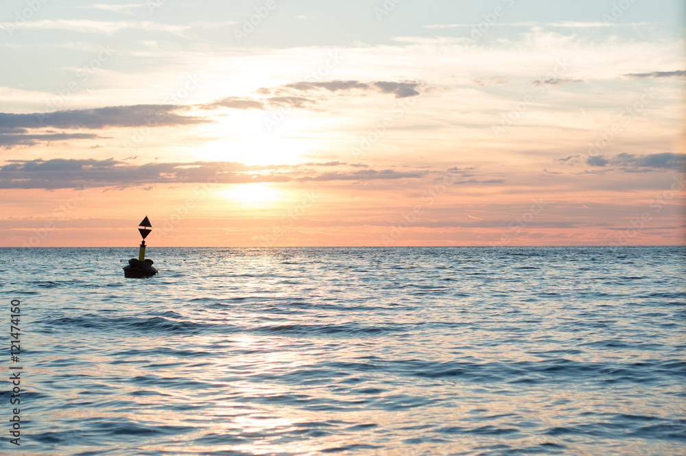 buoy floating in the sunset