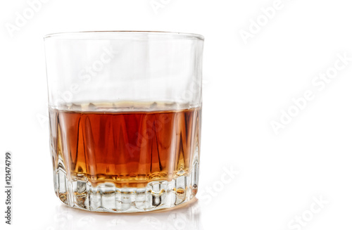 Glass with alcohol on a white background.