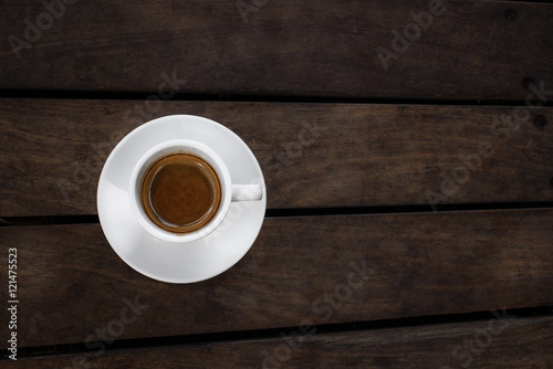 Cup of coffee espresso on a wooden background
