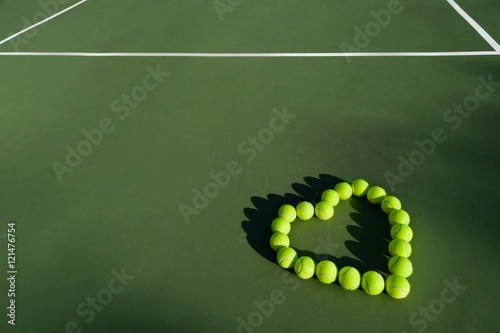 Tennis balls in shape of heart photo