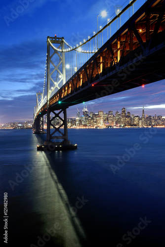 Photography San Francisco skyline framed by the Bay Bridge at sunset