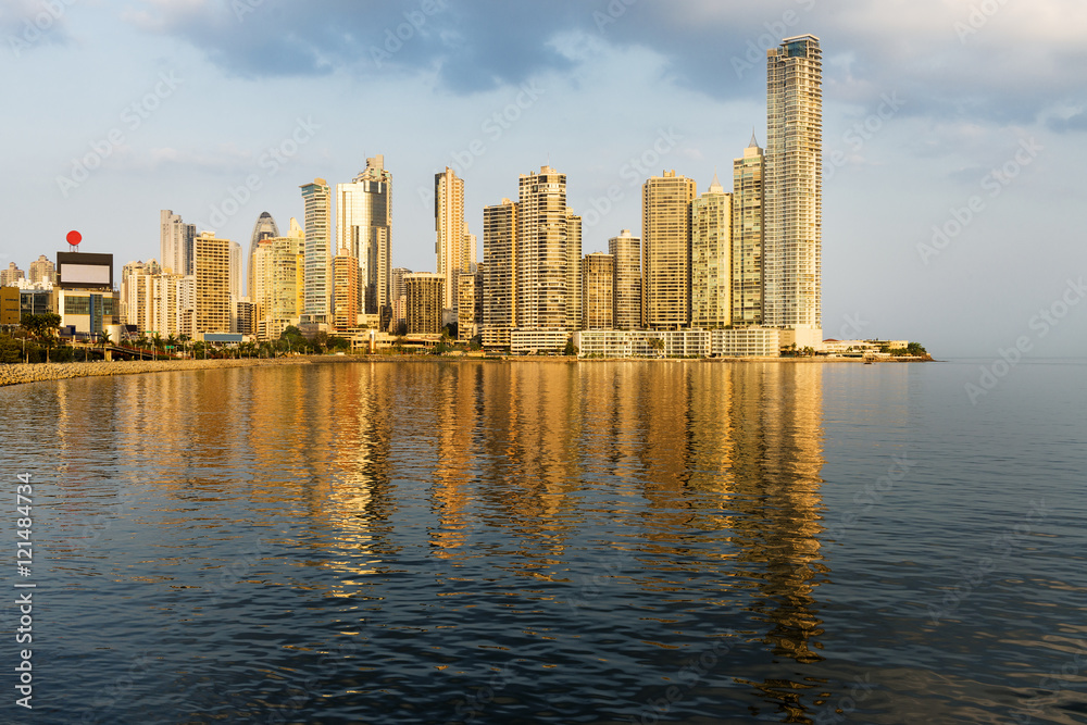 View of the financial district and sea in Panama City, Panama, at sunset.