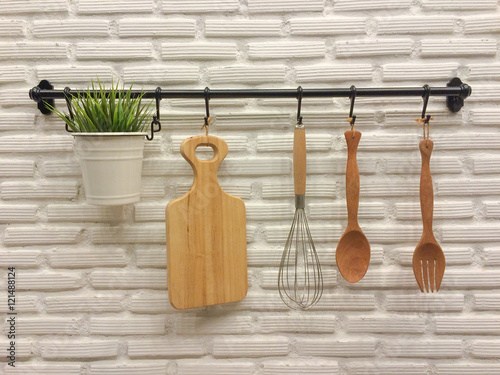 Wallpaper Mural Kitchenware hanging on brick wall. Torontodigital.ca