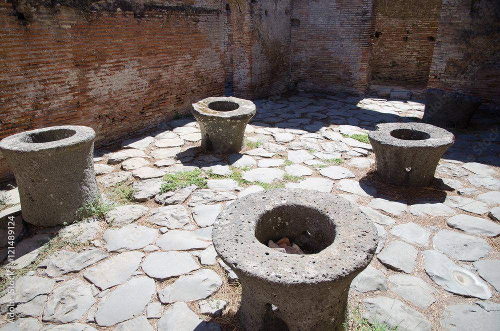 Ruins of Ostia antica, Italy. Mills for grinding cereals in a baker's shop Ruins of Ostia antica, Italy. Mills for grinding cereals in a baker's shop