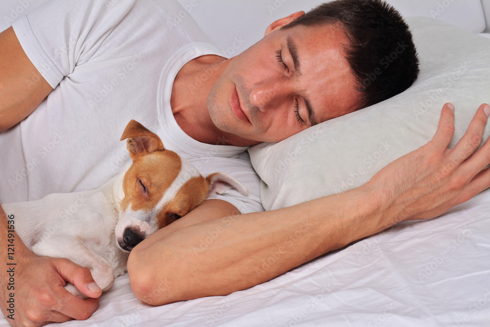 Man and dog sleeping together. Pet Allergies concept Man and dog sleeping together. Pet Allergies concept