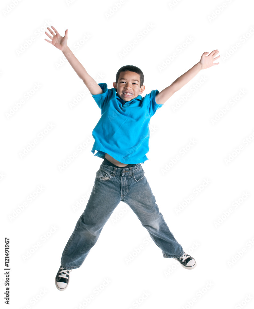 Little boy jumping on white background