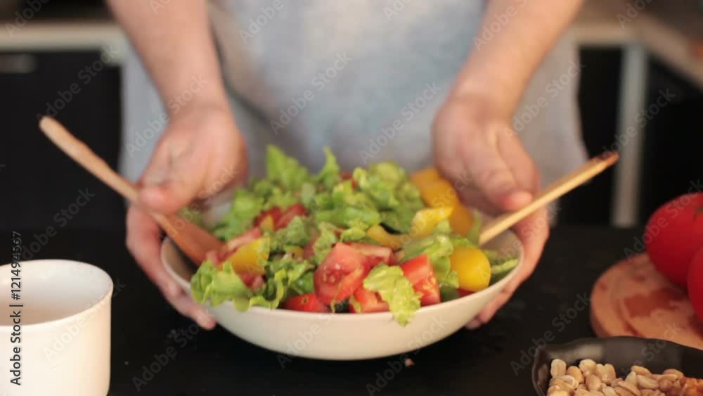 Man Holding a Plate of Vegetable Salad Man Holding a Plate of Vegetable Salad