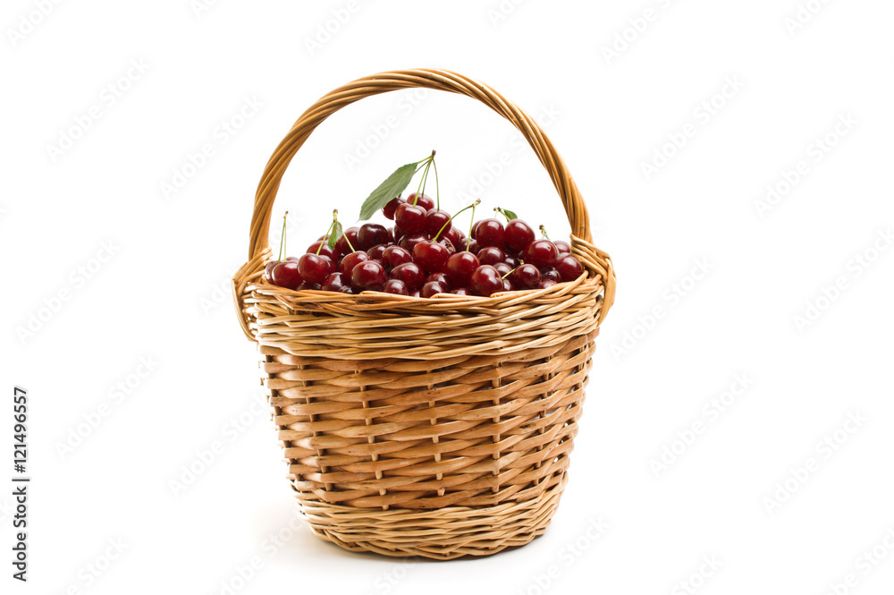 Basket full of fresh red cherry on a white background Basket full of fresh red cherry on a white background