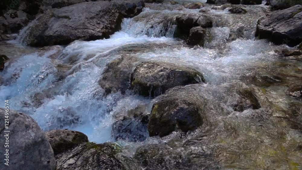 flowing water over stones in mountines river flowing water over stones in mountines river