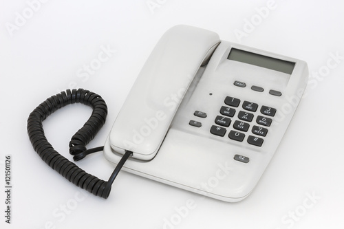 White telephone with push buttons on white background