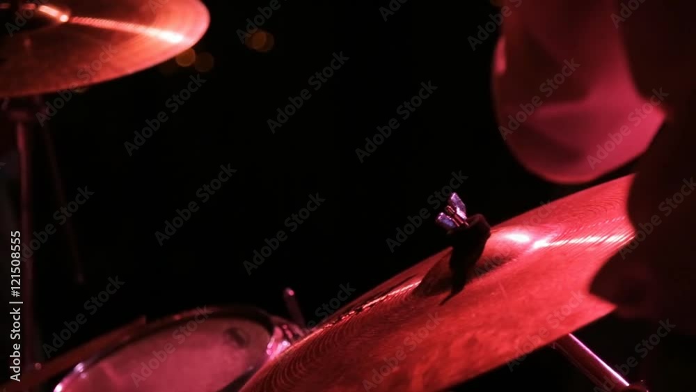 Close up view of musician playing drum and buss.