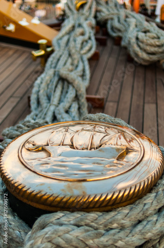 The medal of valor.The rope, old, is firmly anchored to its mooring. Inspires safety, beauty, fierceness. Incredible details of a world that there is no more. photo